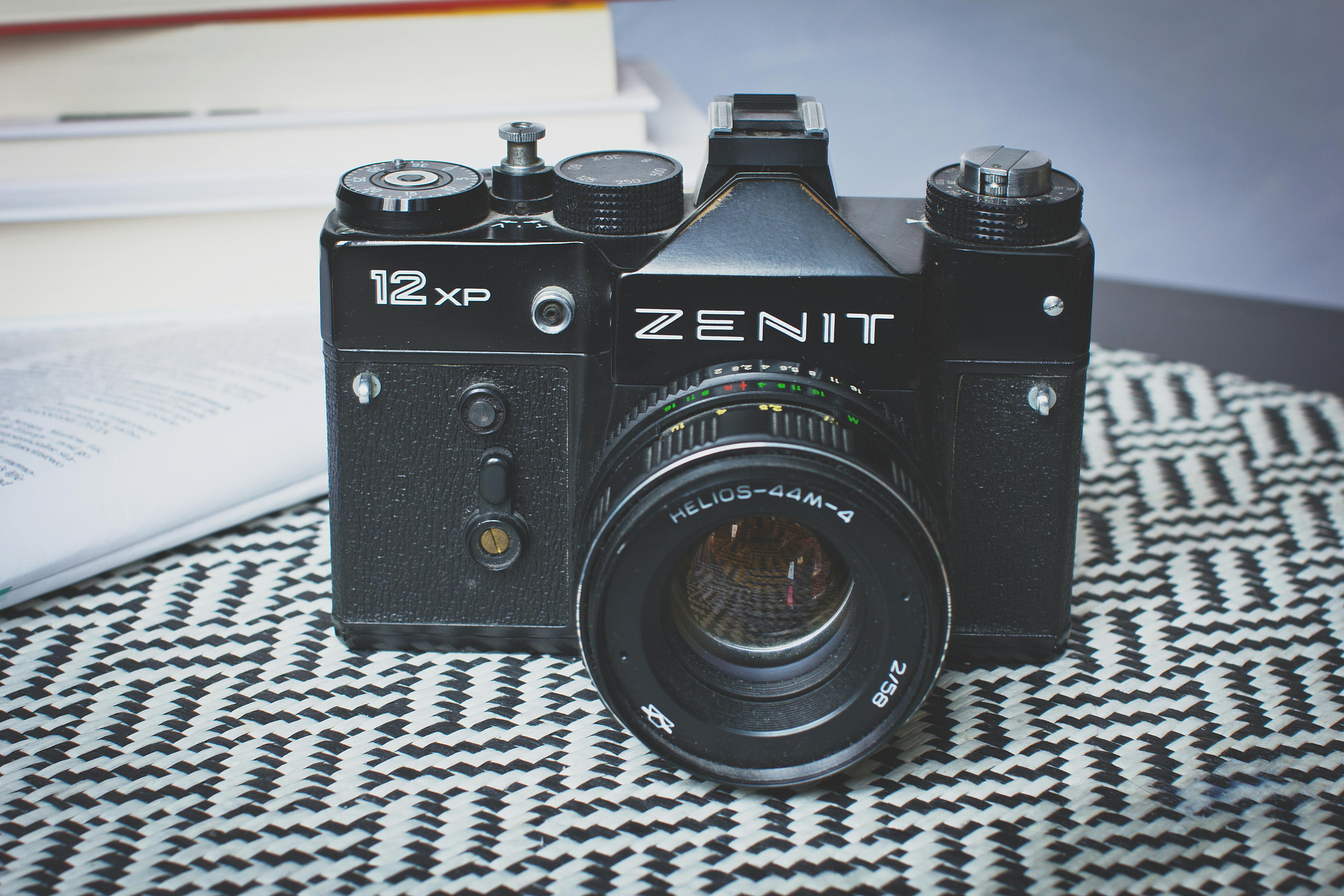 Black Zenit Dslr Camera On Top Of Table Free Stock Photo