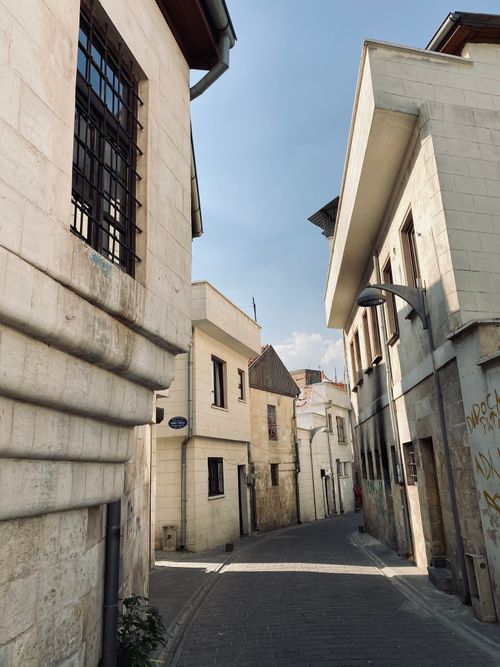 Free Explore a quaint alleyway in a historic European town with charming stone architecture. Stock Photo