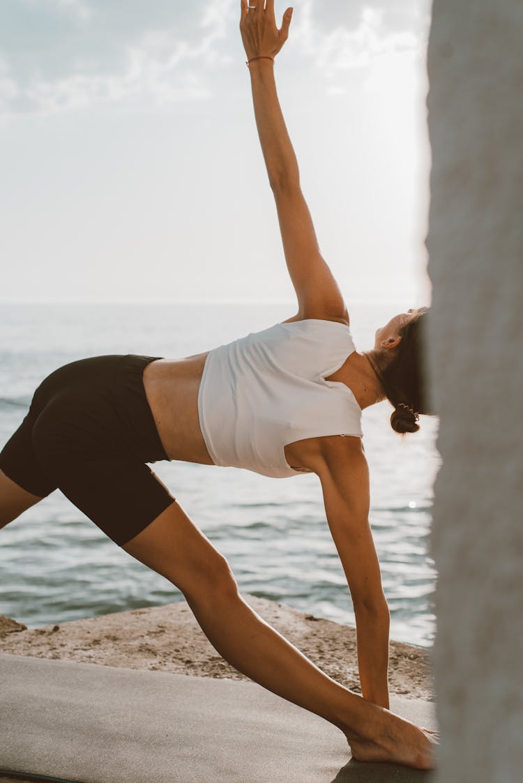 A Person Working Out Near The Sea