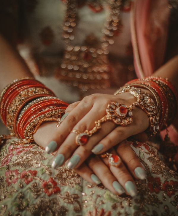 Wedding couple holding hands with floral decorations