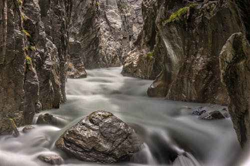 View of a River Flowing a Gorge Photographed in Long Exposure 