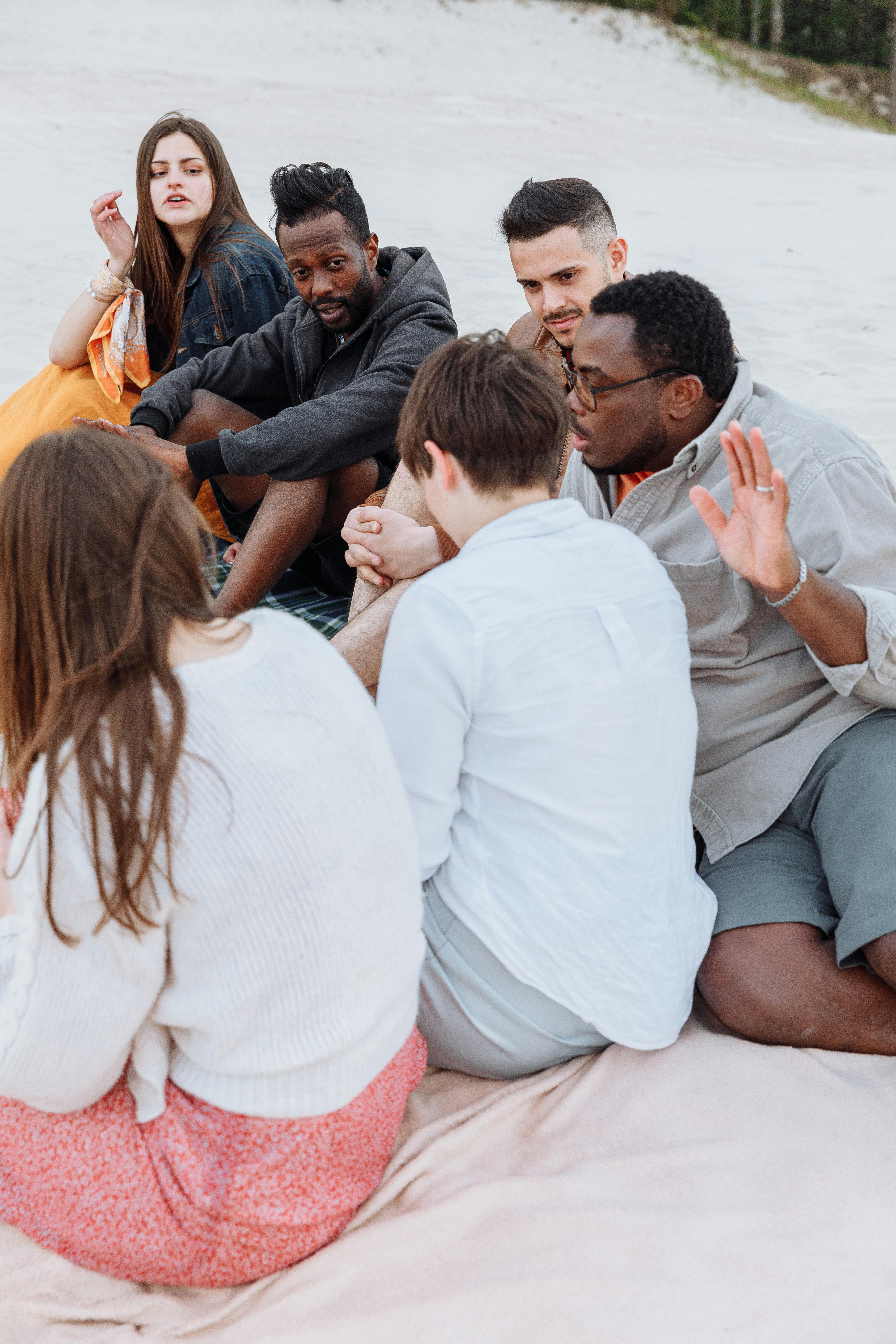 People Sitting On Beach Sand · Free Stock Photo