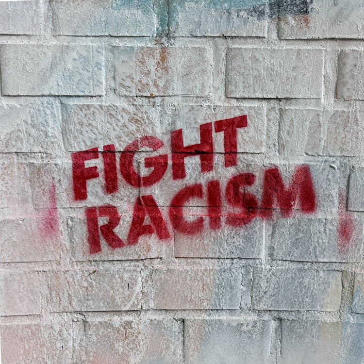 Fight Racism Sign Spraypainted On A Wall