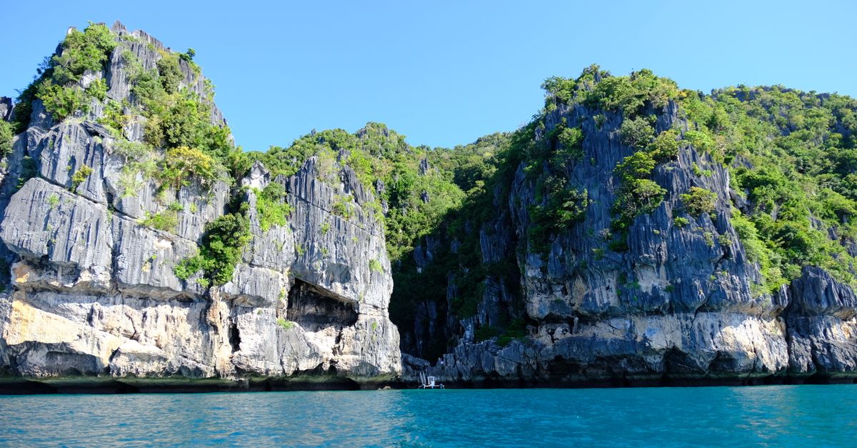 Limestone cliffs rising from tropical turquoise waters