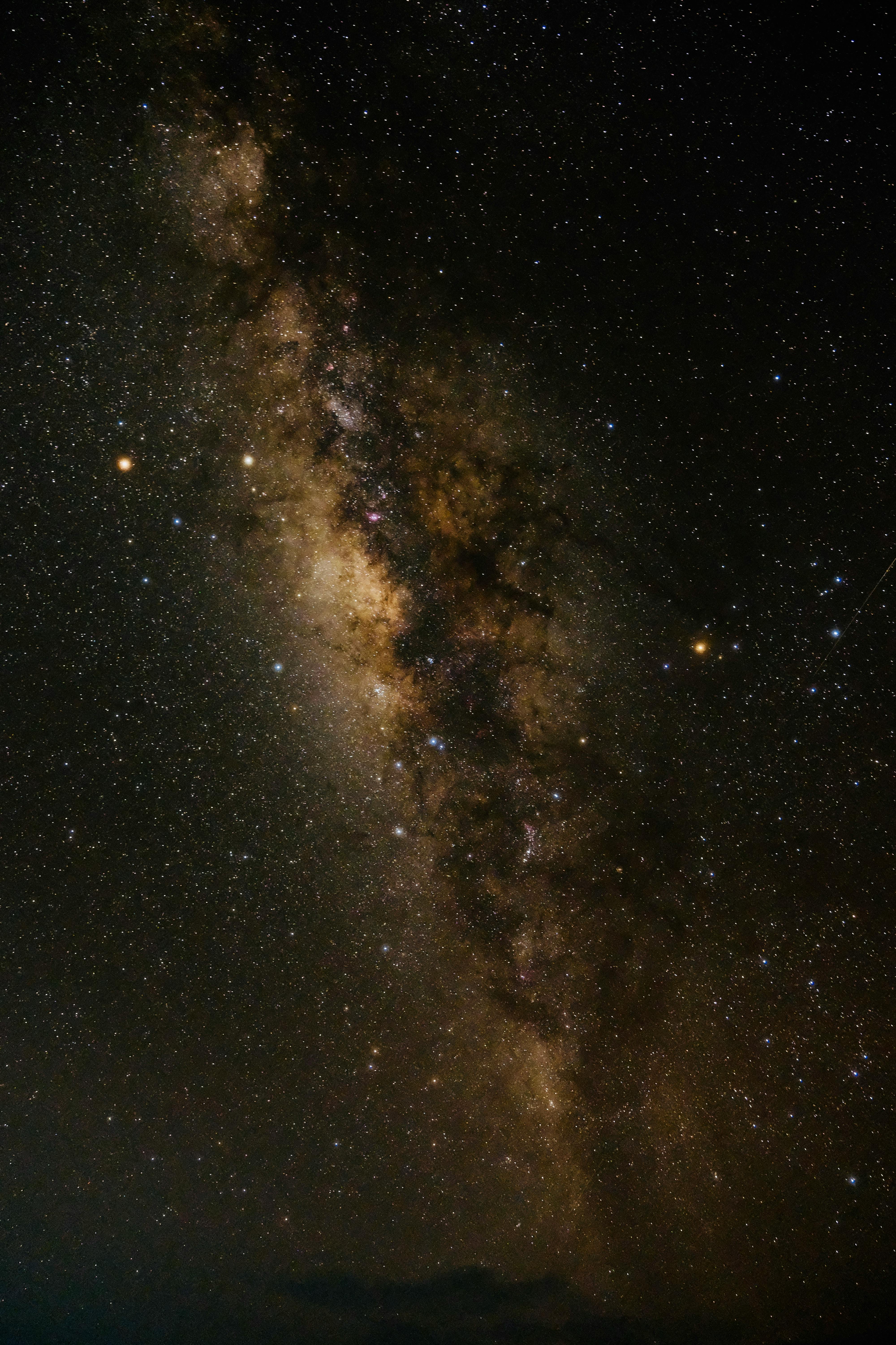 Stunning vertical view of the Milky Way against a dark night sky filled with stars.
