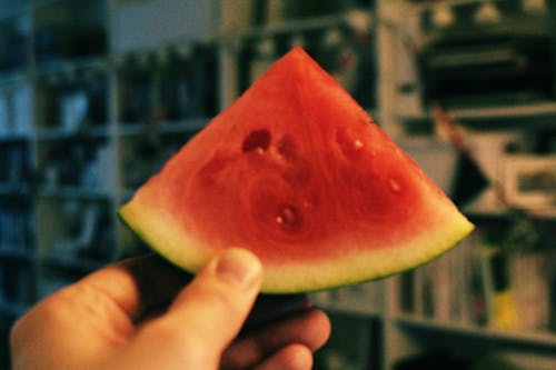 Person Holding Sliced Watermelon