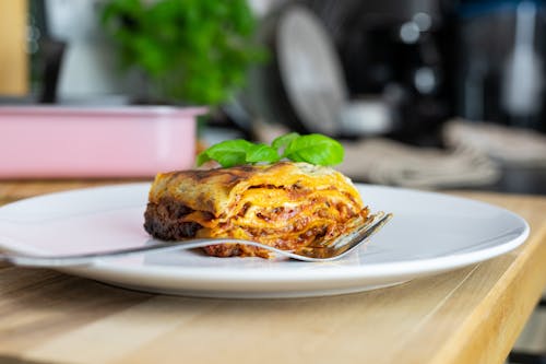 Free Delicious Lasagna Slice on a Ceramic Plate Stock Photo