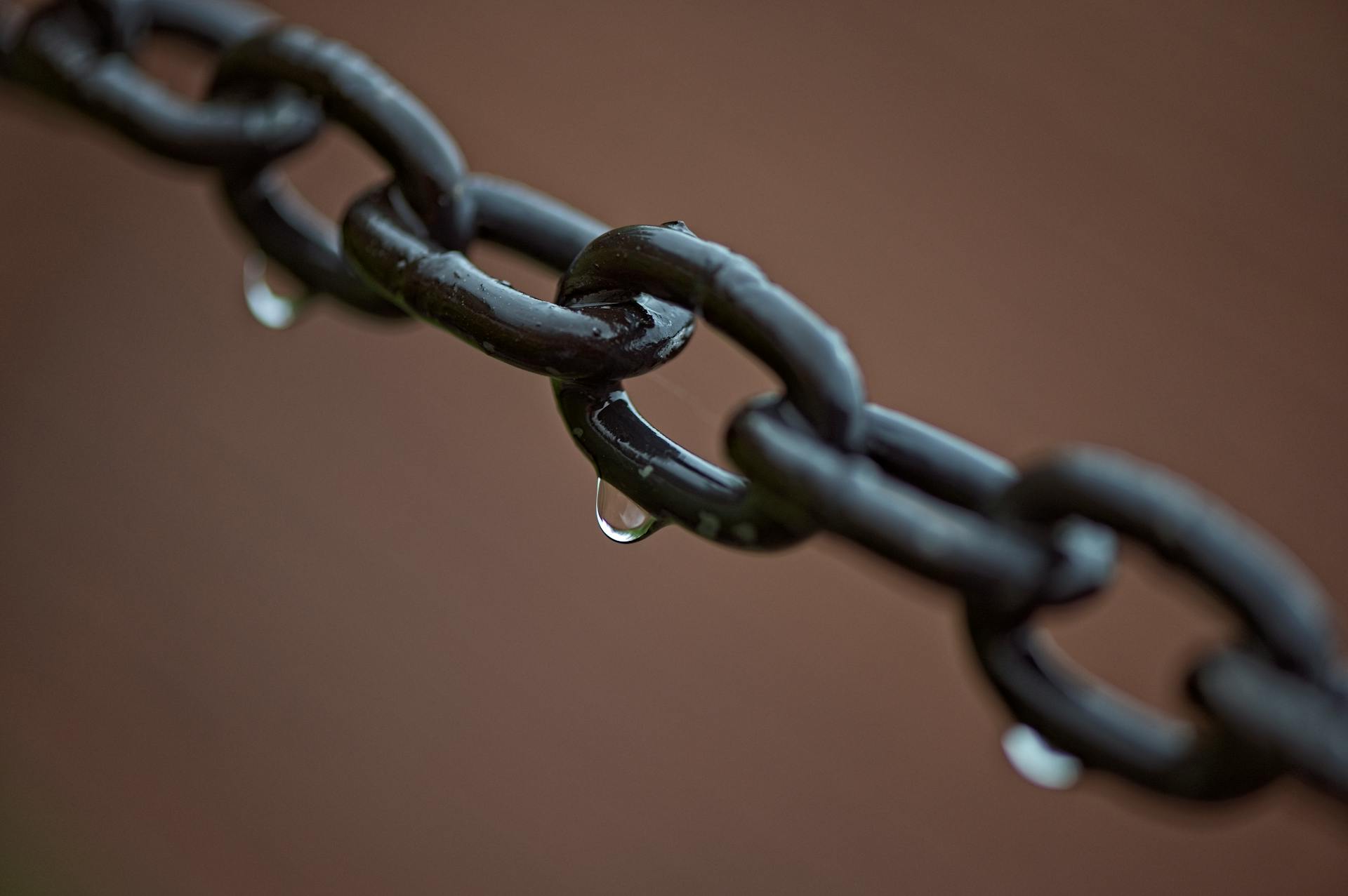 Close-Up Shot of a Wet Chain