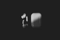 White Apple Airpods on Black Background