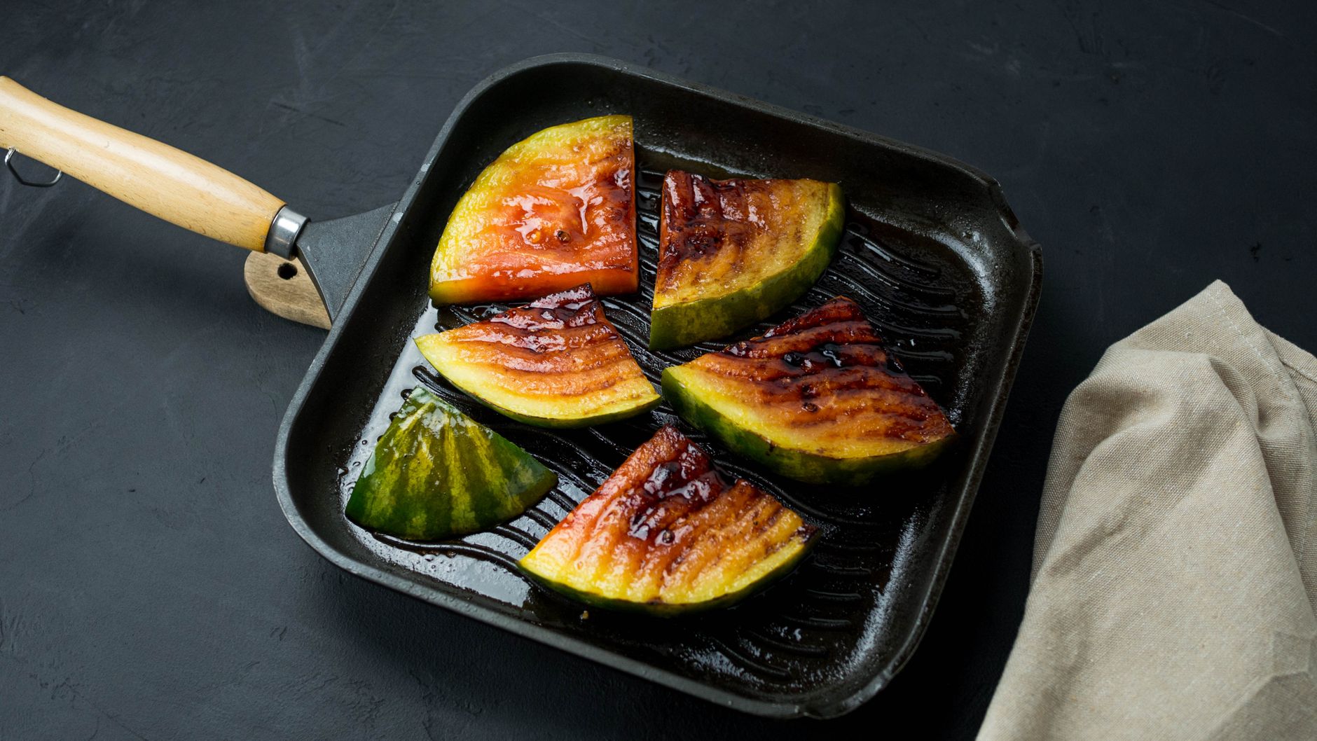 Grilled chicken and vegetables on a Weber deluxe grilling pan with vibrant colors