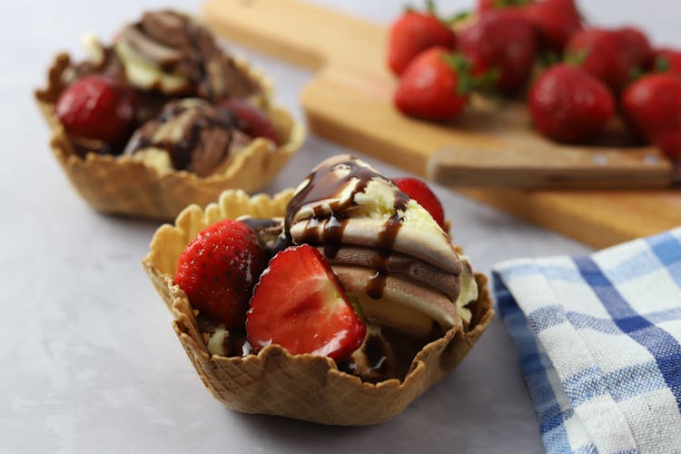 Ice Cream And Strawberries In Wafer Cups