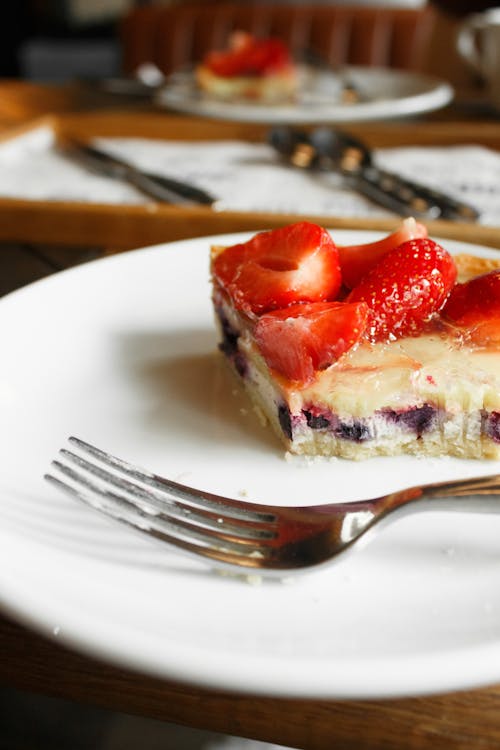 Tart with Strawberries and Fork on Plate 