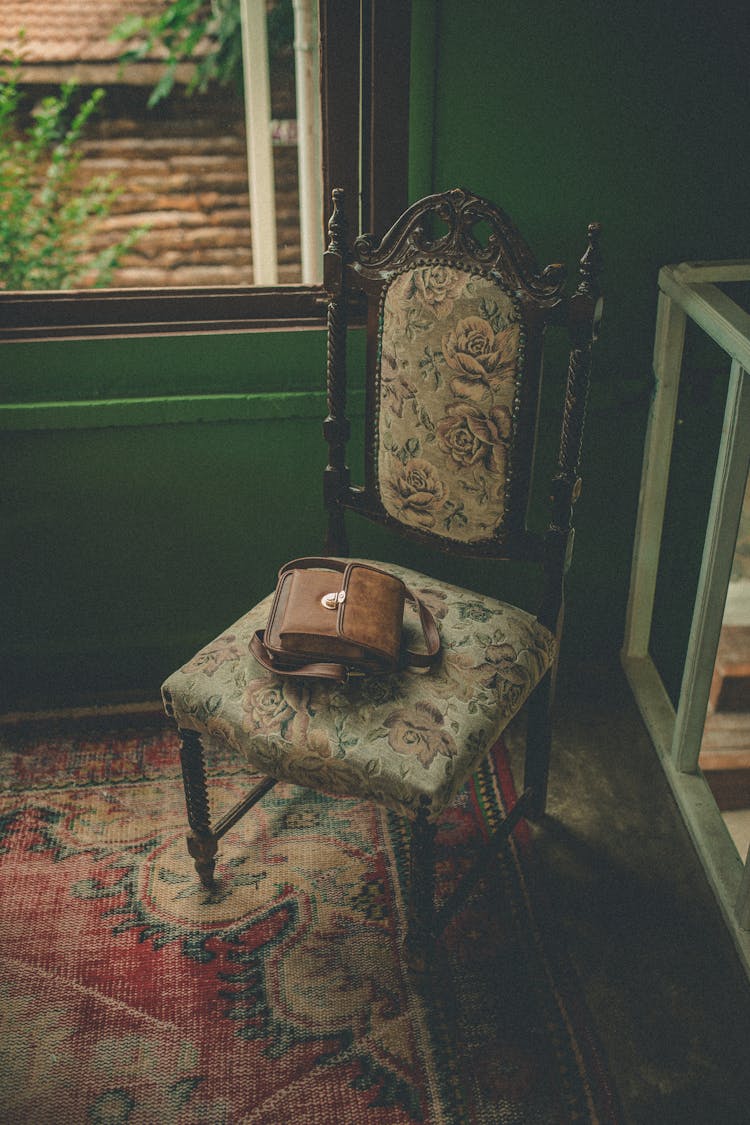 Retro Chair With Bag On Carpet In Room