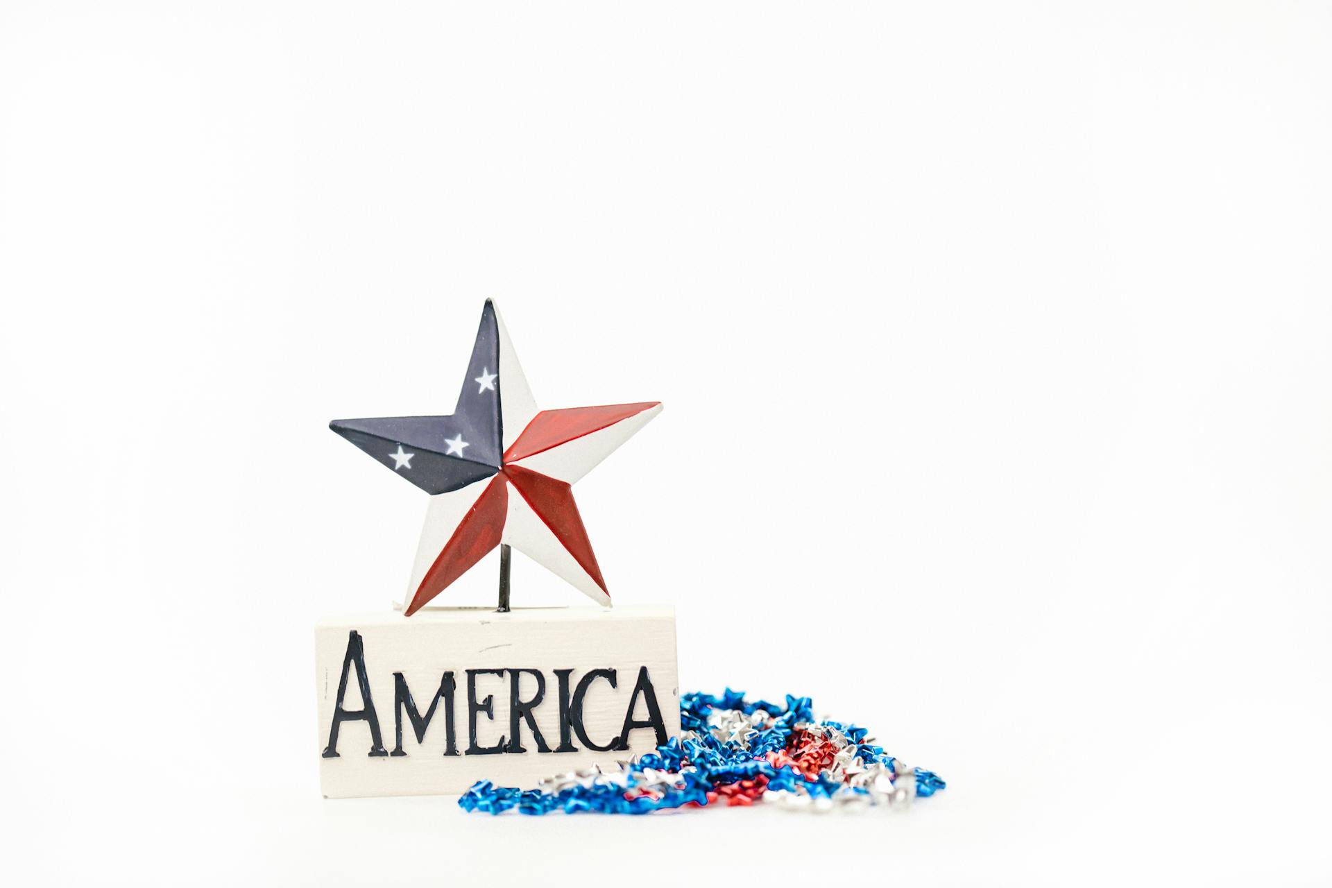 A Miniature Star on a Pedestal with America Written on It