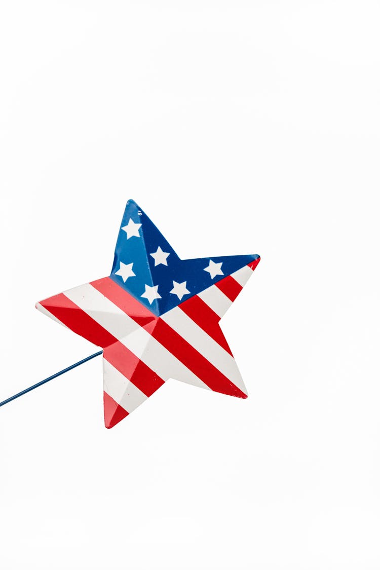 A Miniature Star On A Stick With Stars And Stripes