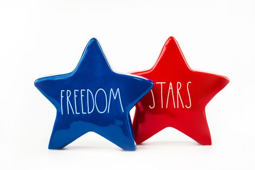 Red and blue star decorations with words 'FREEDOM' and 'STARS', symbolizing patriotism.