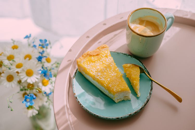 Cup Of Tasty Latte Coffee With Cheese Cake On Tray