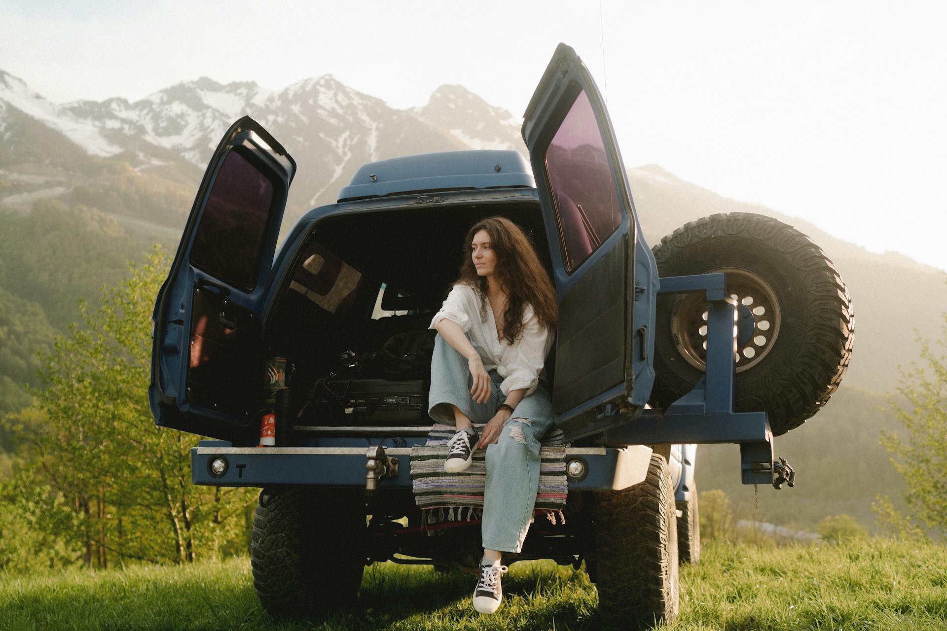 Woman sitting on a 4x4 Truck