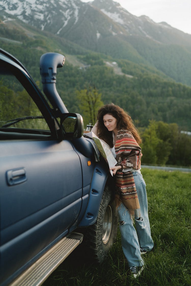 Woman Leaning Beside A 4x4 Truck 