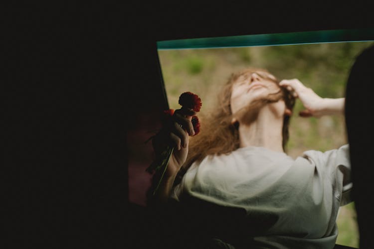 A Woman Holding Flower 