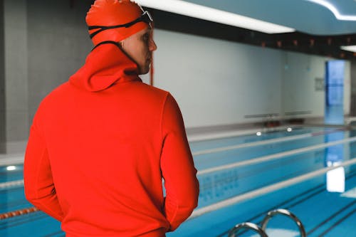 A Swimmer Standing by the Poolside