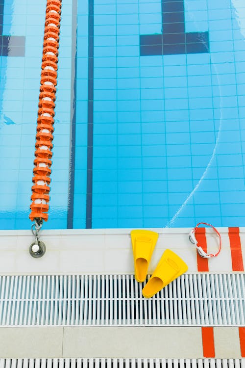 Free Swimming Gears on Poolside Stock Photo