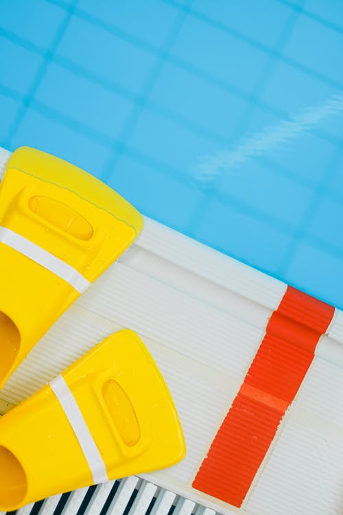 Free Flippers Beside a Swimming Pool Stock Photo