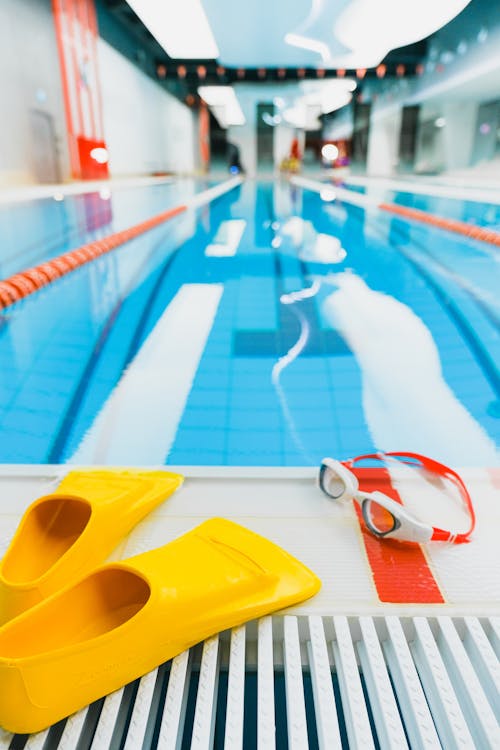 Free Swimming Gears near a Swimming Pool Stock Photo