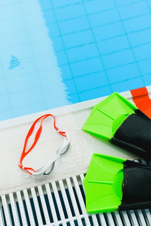 A Pair of Flippers and Goggles on Poolside