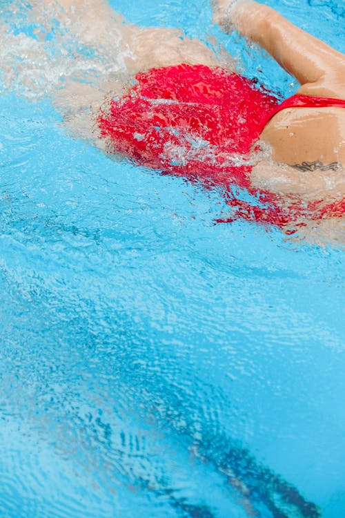 Person Swimming in a Pool