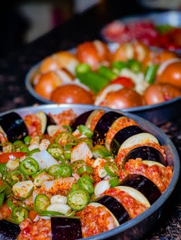 Colorful sliced vegetables on a tray, perfect for healthy cooking.