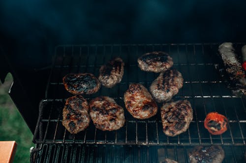 Free Grilling Burgers on a Griller Stock Photo