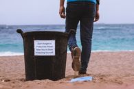 Person in Blue Denim Jeans and Brown Boots Standing on Beach Shore