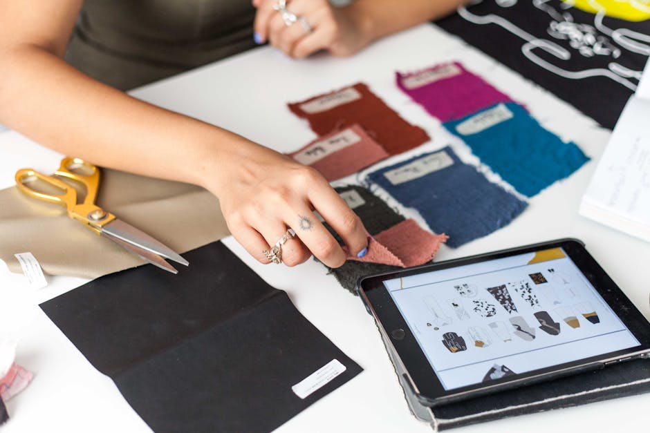 designer sketching a custom apron design on a tablet next to fabric swatches - bartenders uniforms designer sketching a custom apron design on a tablet next to fabric swatches - bartenders uniforms
