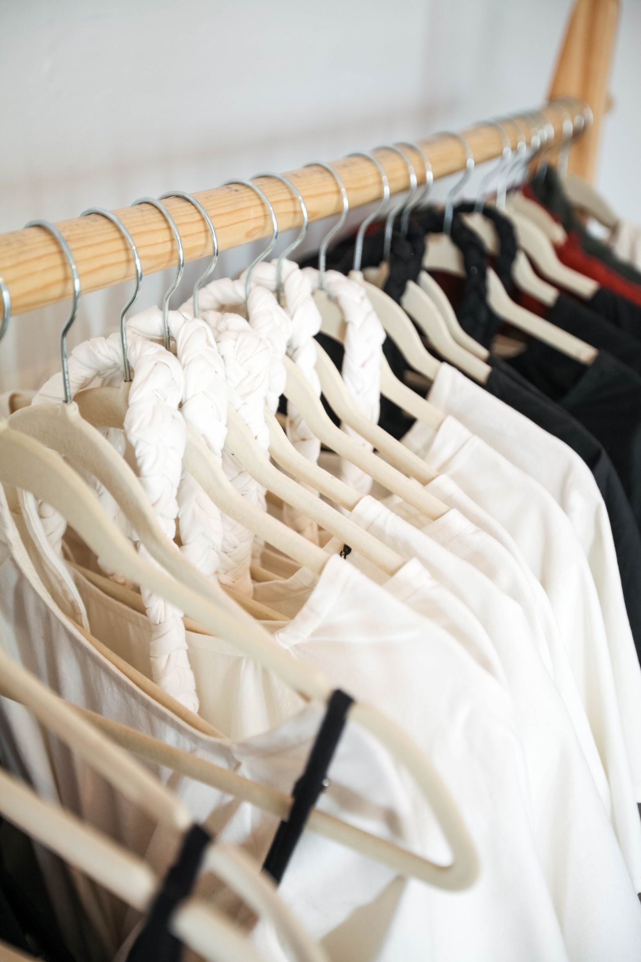Minimalist clothing rack with a black and white capsule wardrobe