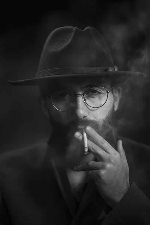 Free A Man Smoking a Cigarette  Stock Photo