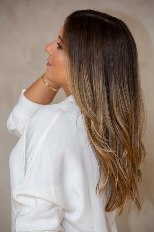 Woman in White Dress Shirt with Long Brown Hair