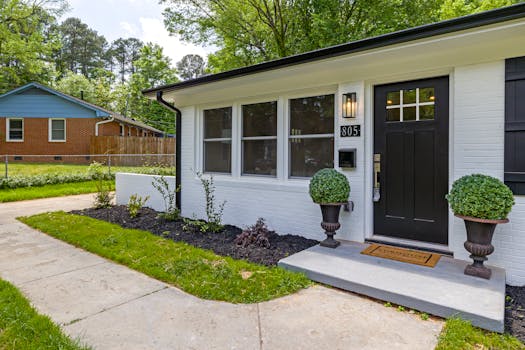 Charming modern suburban house with a landscaped front yard and welcoming entrance.