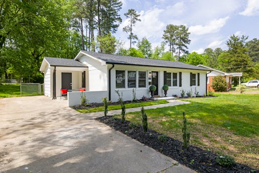 Modern suburban home with spacious yard and elegant landscaping.