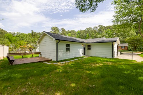 White and Gray Wooden House Under White Clouds