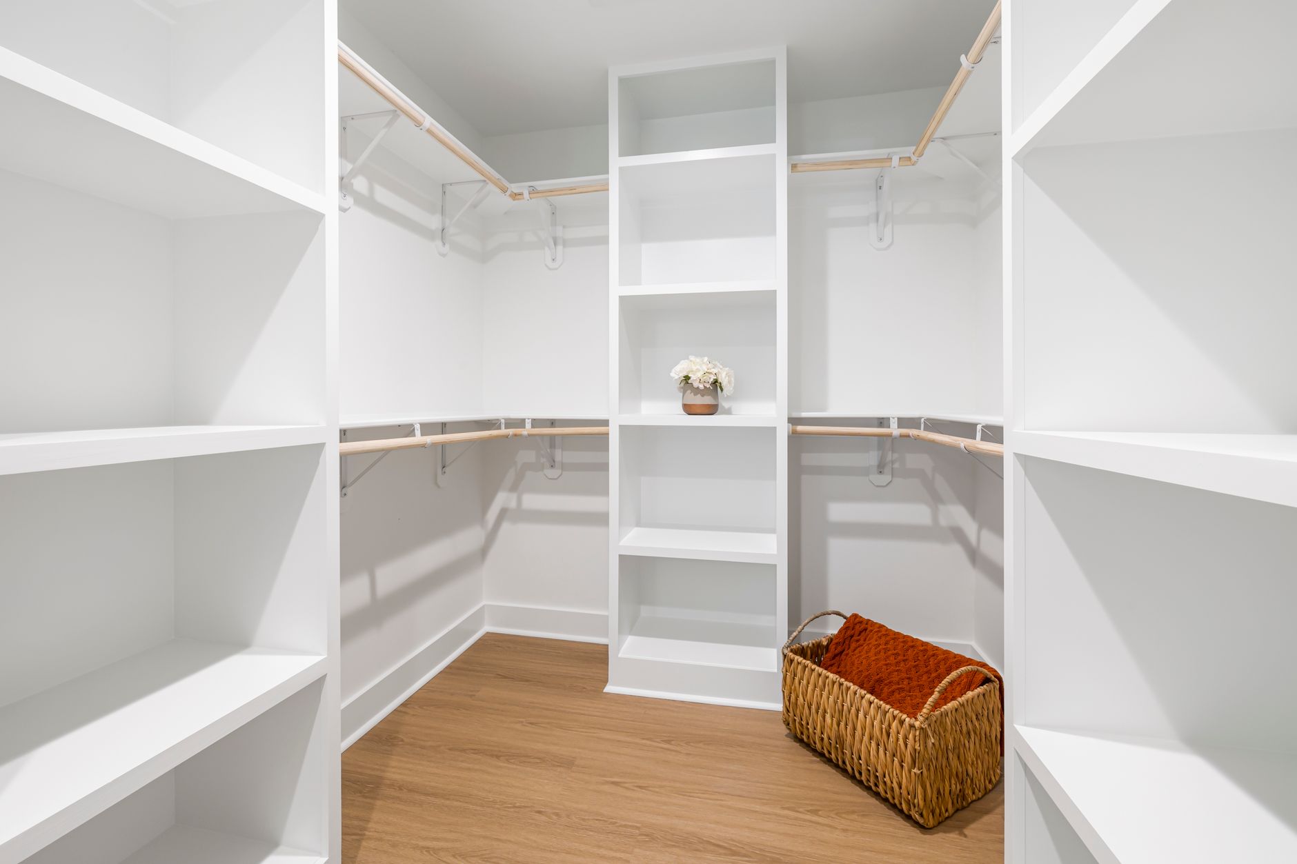 Creative Storage Solutions for Small Homes That Feel Bigger 3 Luxurious empty walk-in closet with shelves and a basket in a white room. storage solutions