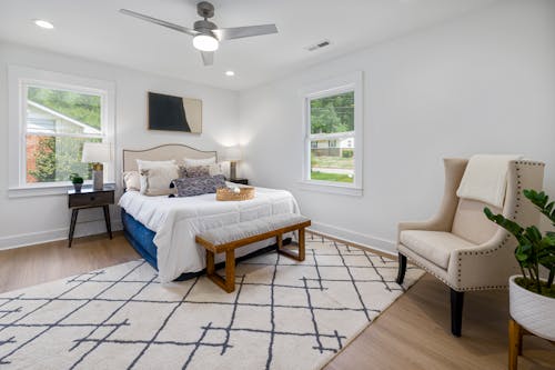 White and Brown Bed Near White Wooden Framed Glass Window