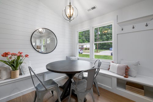 Round Wooden Table Near Window