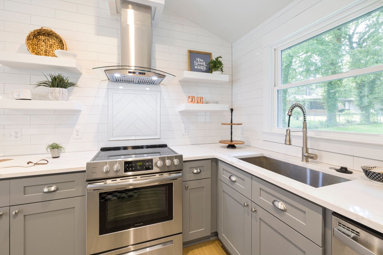 open-shelving-farmhouse-kitchen Kitchen with open wooden shelving displaying dishes