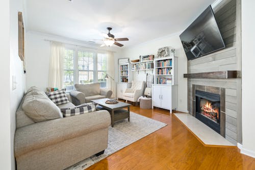 A Living Room with a Fireplace with a Flat Screen on the Wall