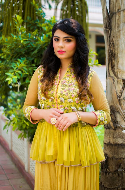 A Woman in Yellow Sheer Floral Dress