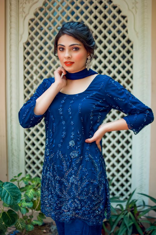 A Beautiful Woman in Blue Floral Top with Scarf