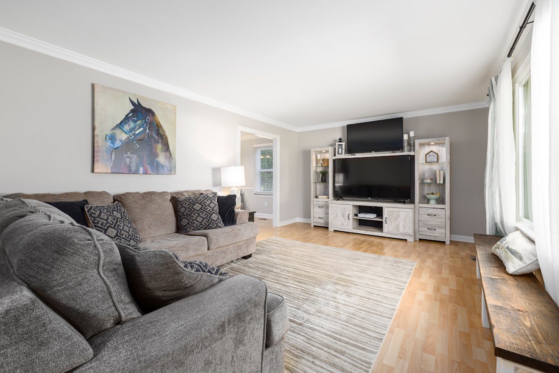 Gray Sofa and Wooden Bench Near Window