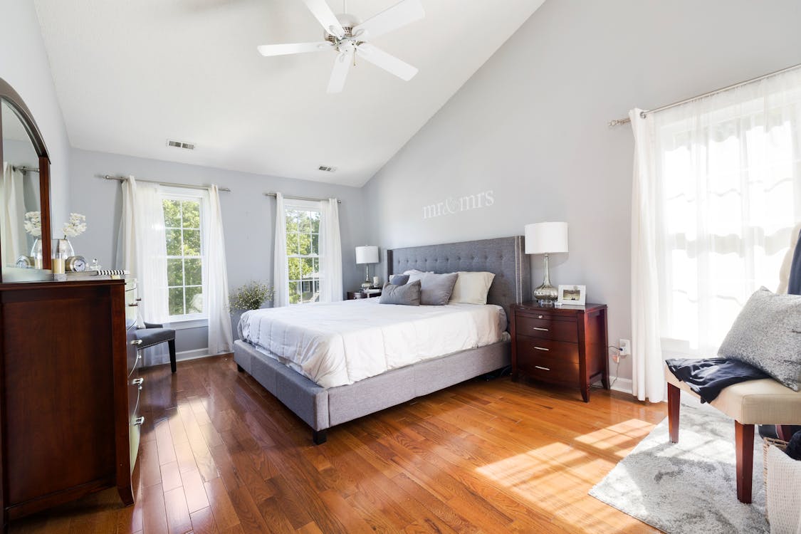 A Couple's Bedroom with Wooden Furniture