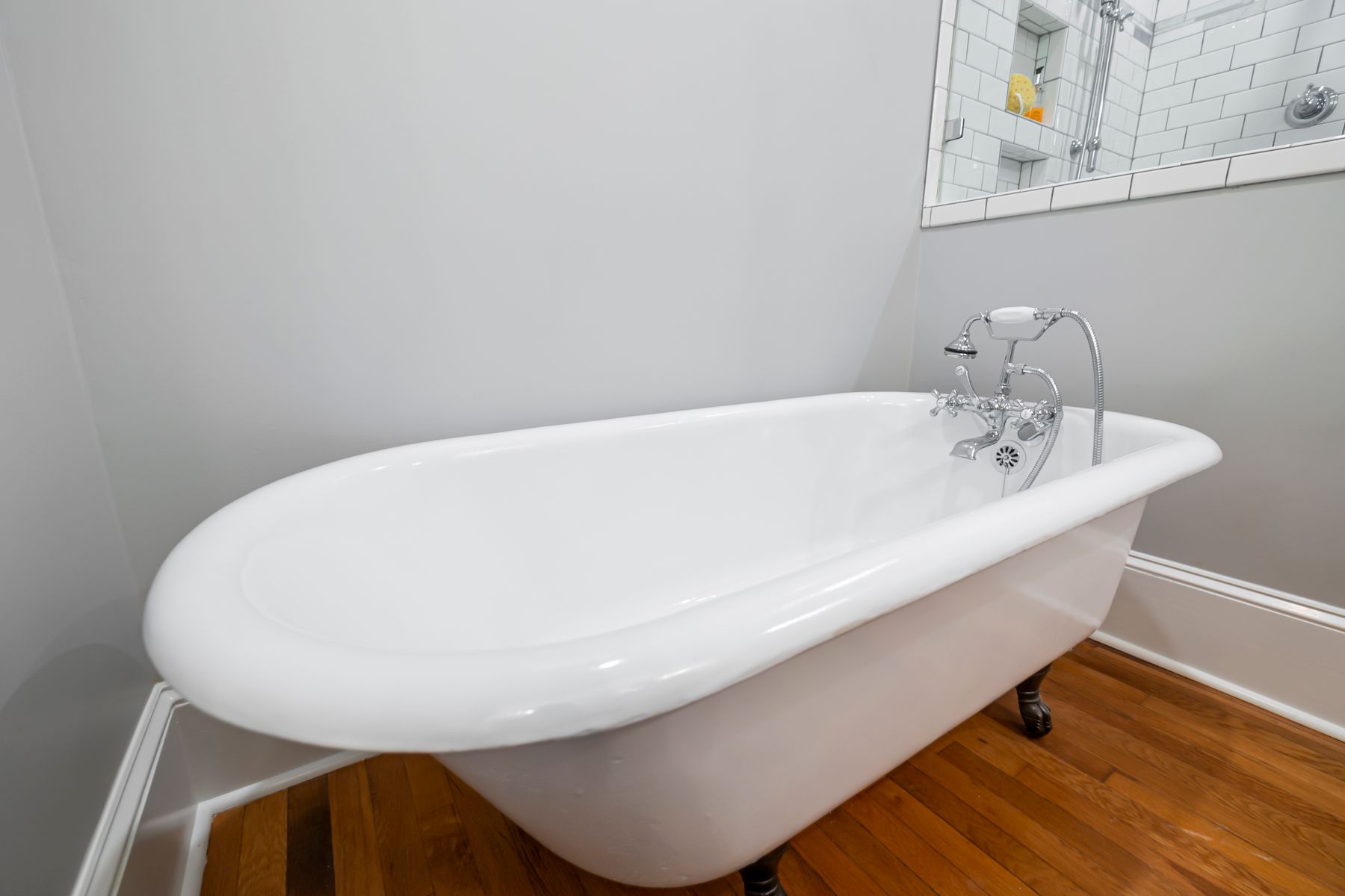 Victorian-inspired bathroom with clawfoot tub and restrained period detail